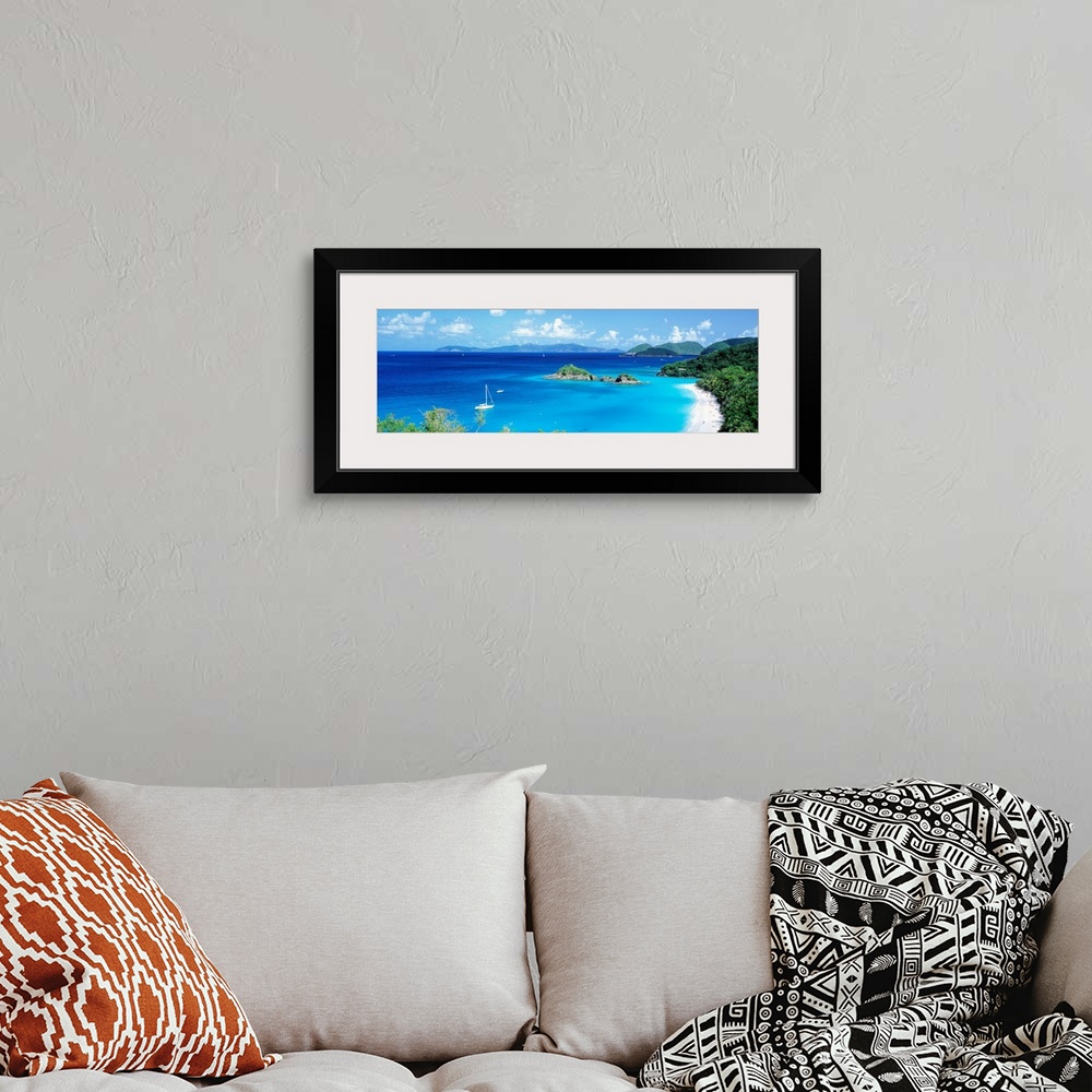 A bohemian room featuring Panoramic photograph of a couple boats sitting in the clear waters of Trunk Bay in the Virgin Isl...
