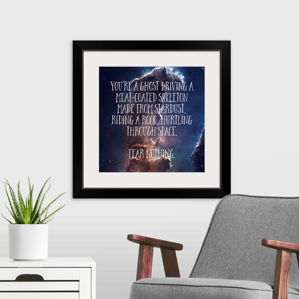 A modern room featuring Humorous message about the life and existence, over a nebula.