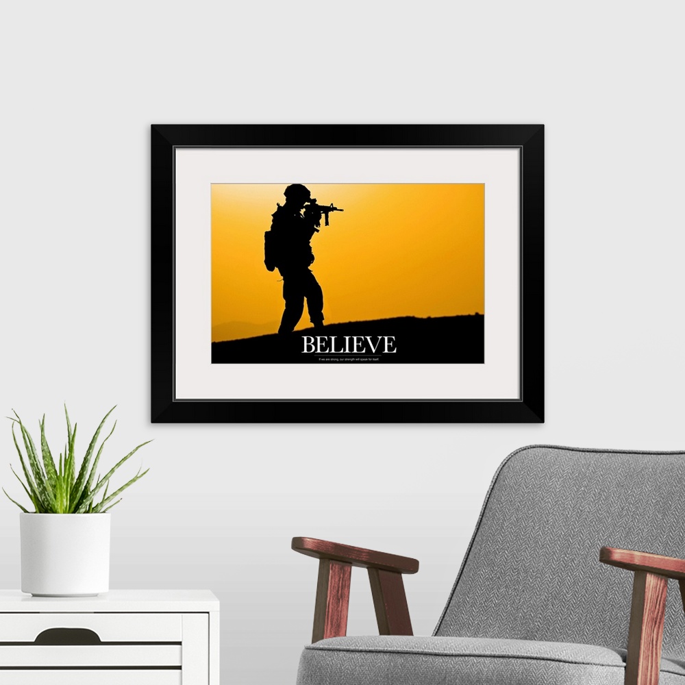 A modern room featuring This piece shows a silhouette of a solider holding his gun with the word "Believe" written below ...