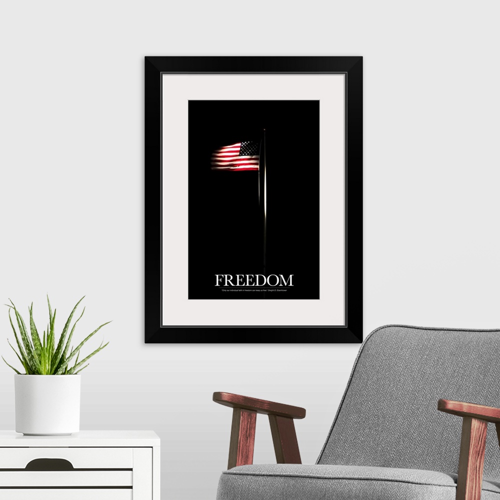 A modern room featuring Vertical photo on canvas of an American flag shining through the dark background with text at the...