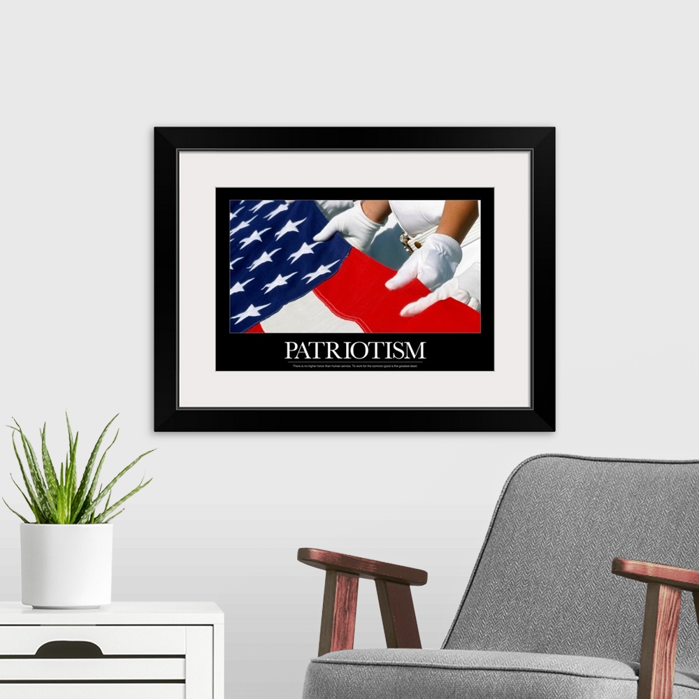 A modern room featuring Big, horizontal, motivational wall hanging of gloved hands holding the American Flag, the image i...