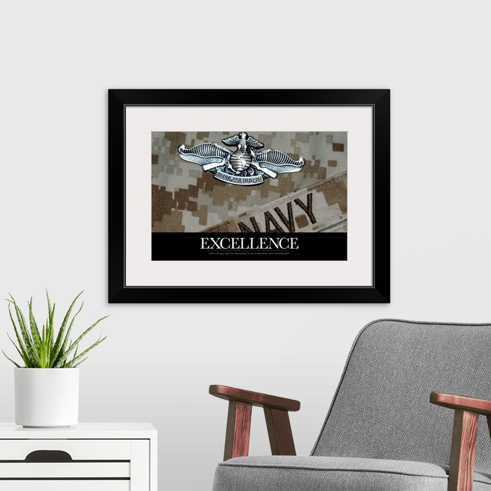 A modern room featuring Inspirational message about excellence underneath a close up of a Navy military uniform and a sil...