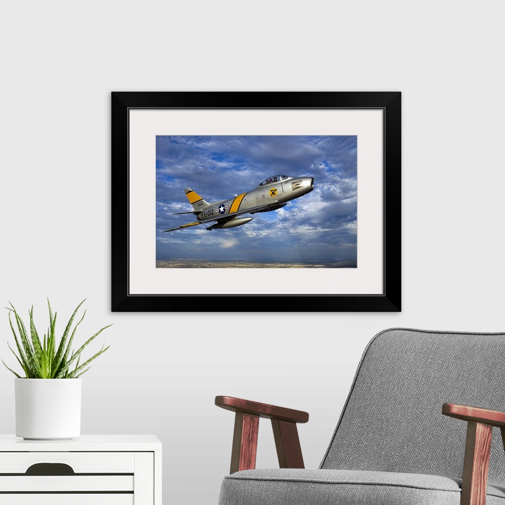 A modern room featuring A F-86 Sabre jet in flight over Glendale, Arizona.