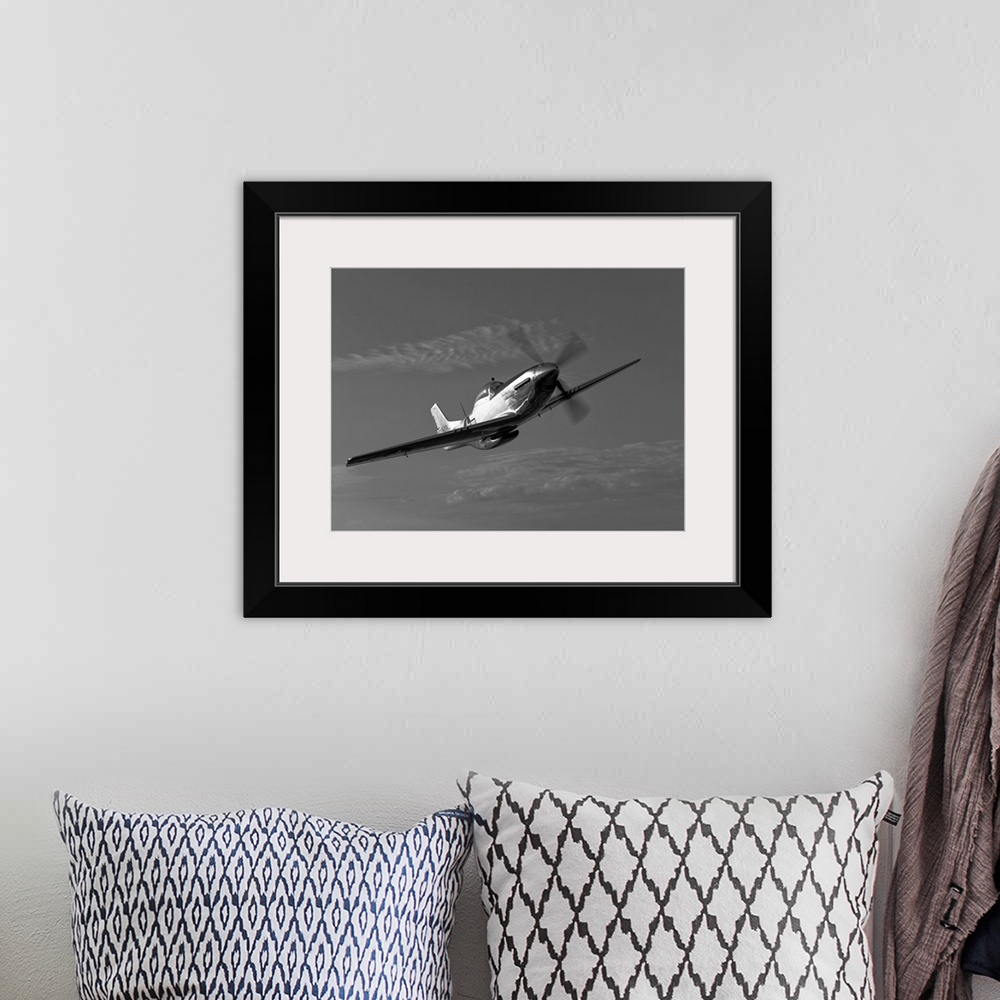 A bohemian room featuring A P-51D Mustang in flight near Chino, California.