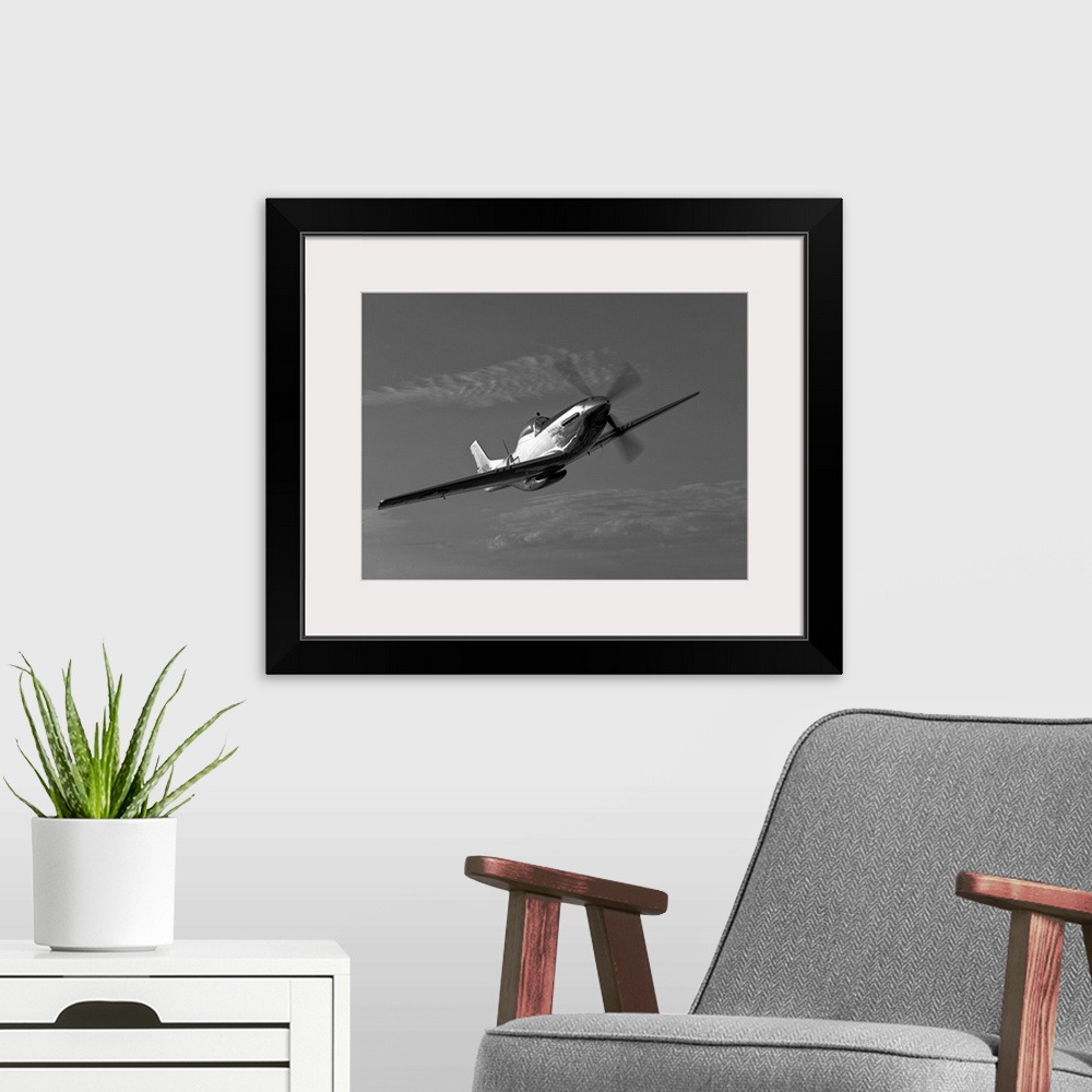 A modern room featuring A P-51D Mustang in flight near Chino, California.
