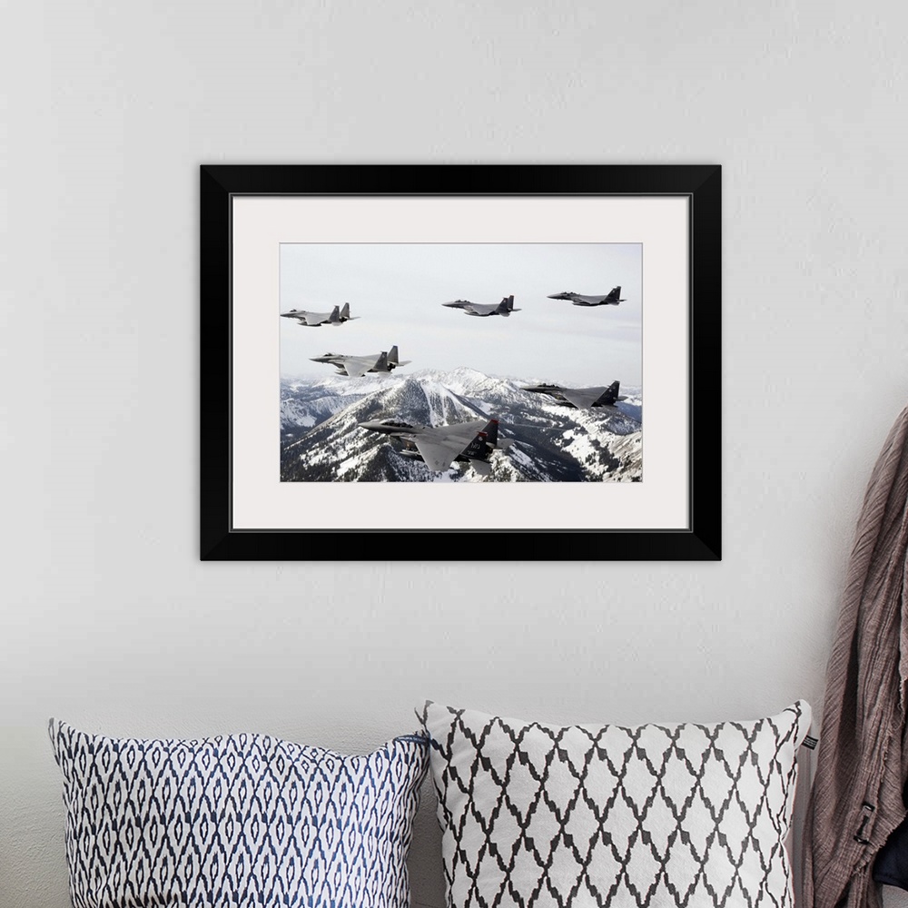 A bohemian room featuring Photograph of airplanes or jets flying over snow covered mountains.