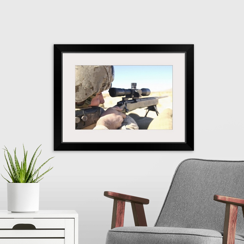 A modern room featuring A soldier aims in with his M40A3 Scout Sniper Rifle