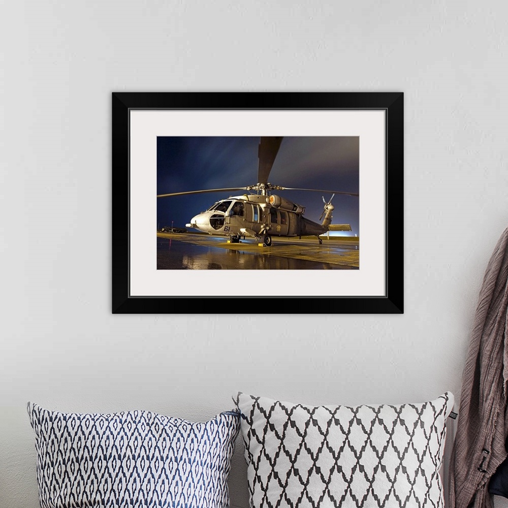 A bohemian room featuring A US Navy MH60S Seahawk helicopter