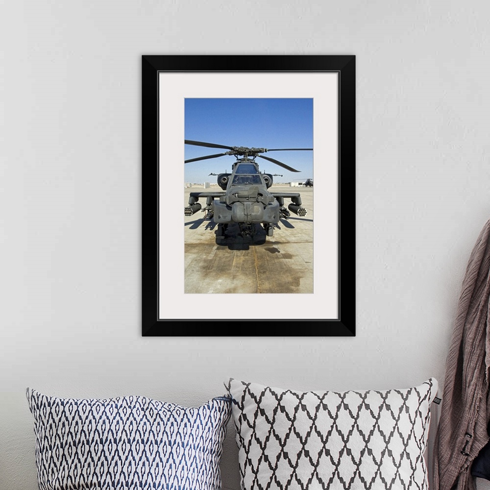 A bohemian room featuring An AH64D Apache Longbow Block III attack helicopter sits on the flight line