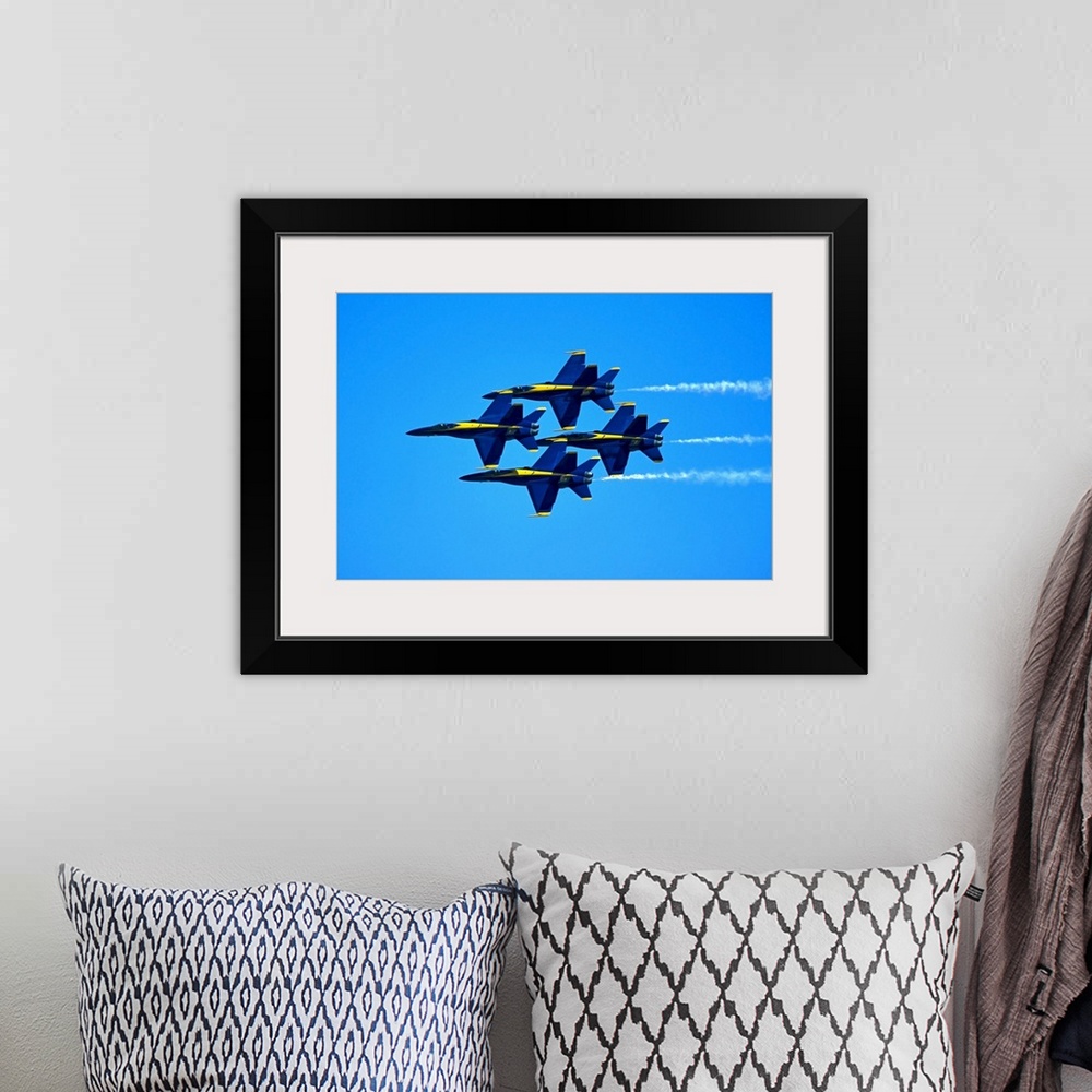 A bohemian room featuring Blue Angels flying in formation