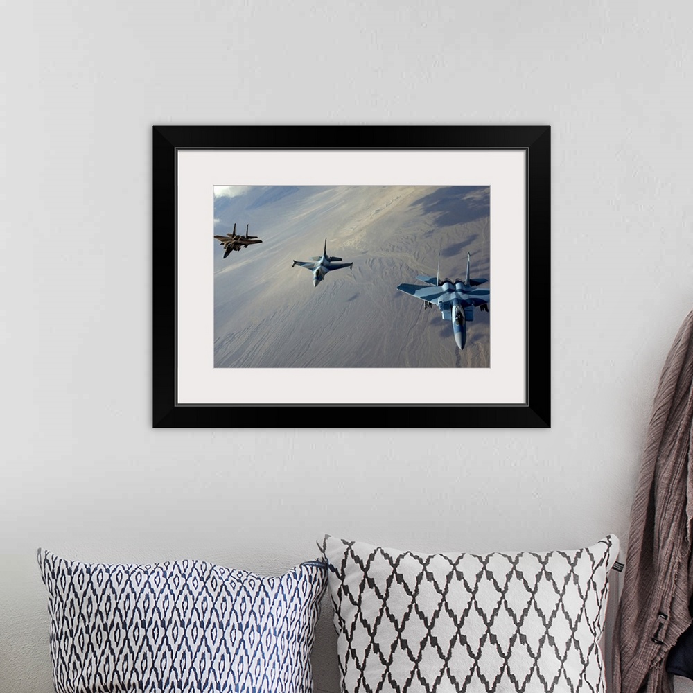 A bohemian room featuring Big photo on canvas of three fighter jets flying in a diagonal line formation above a desert.