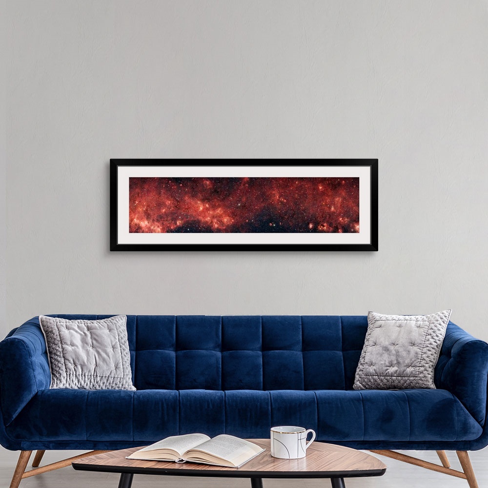 A modern room featuring Extremely panoramic shaped photograph of our native galaxy spread out across the sky.