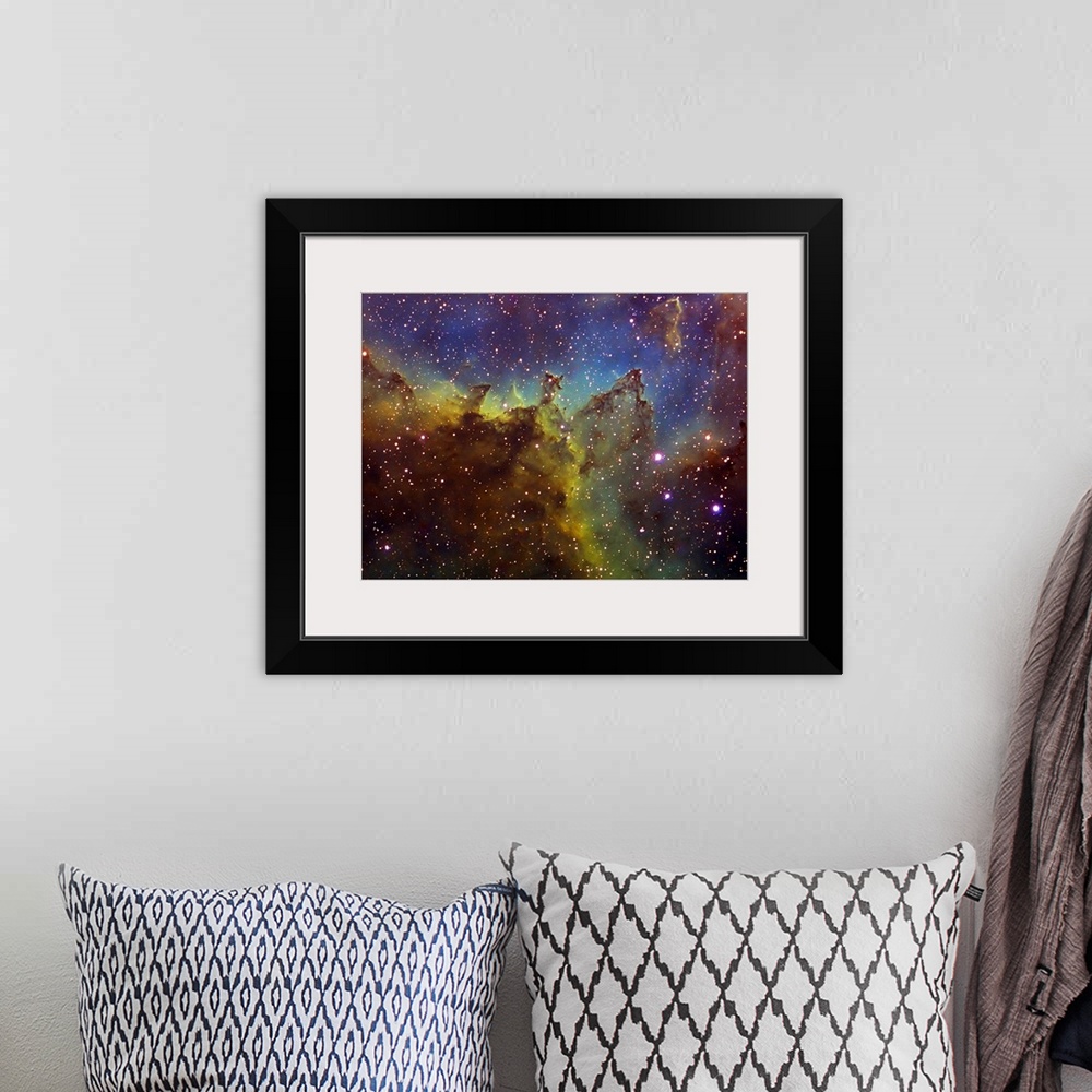 A bohemian room featuring Photograph of stars with multicolored waves of gas and clouds in the background.