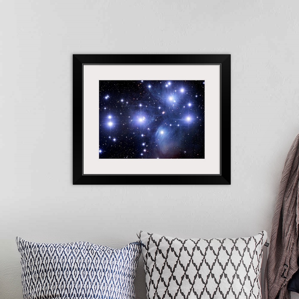 A bohemian room featuring Large photograph taken of the Seven Sisters, an open star cluster located within the constellatio...