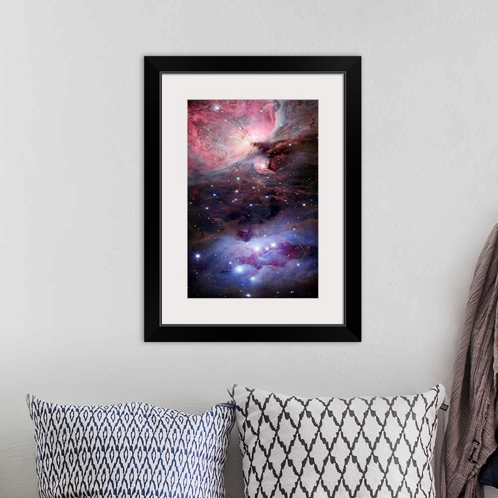 A bohemian room featuring Large photograph depicts a portion of space littered with brightly filled stars, three of which m...
