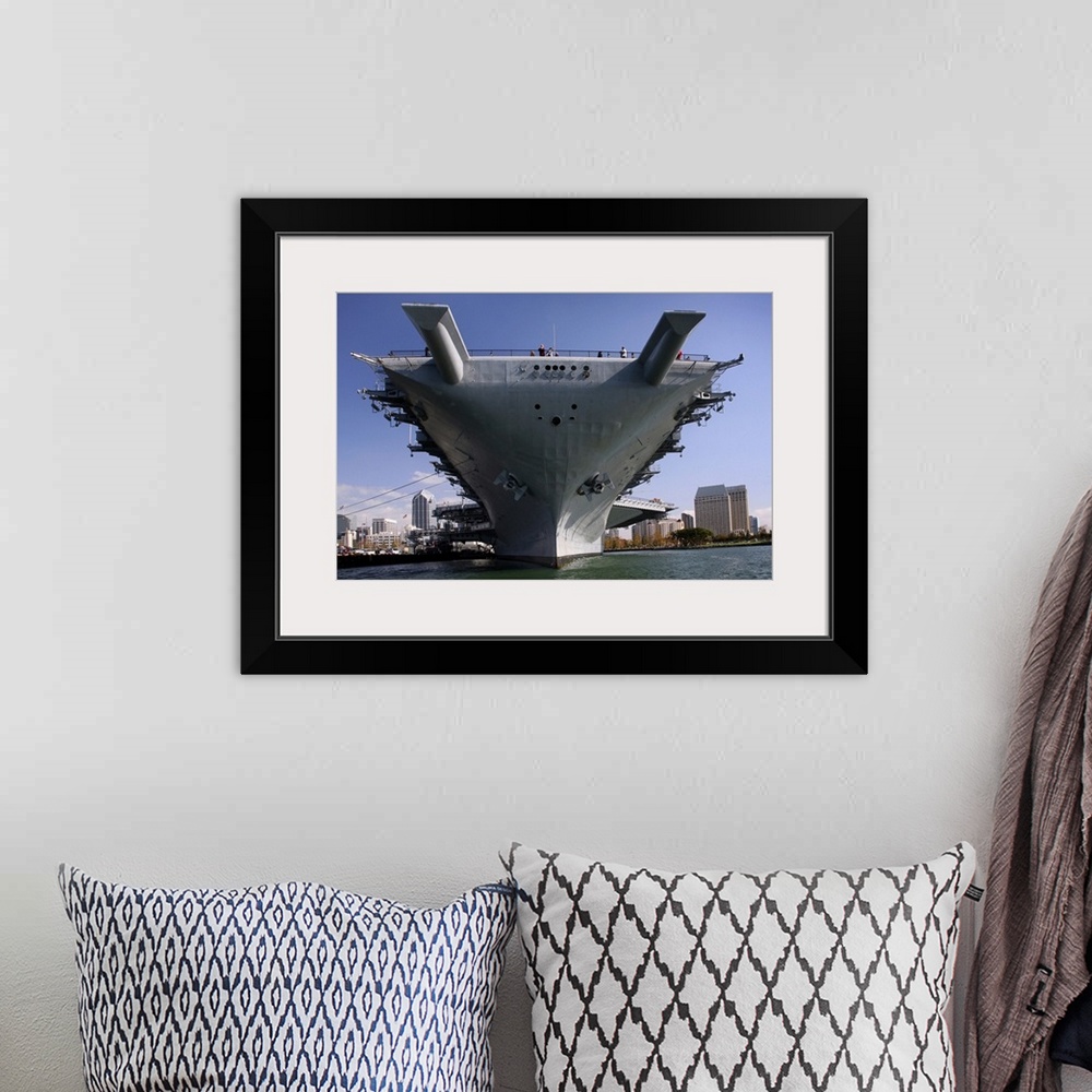 A bohemian room featuring The USS Midway berthed pierside
