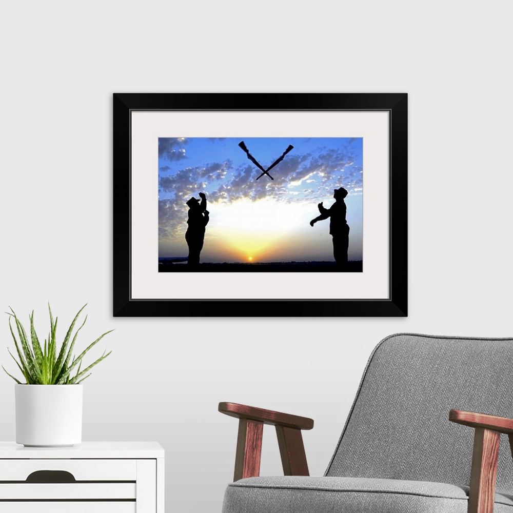 A modern room featuring Photograph of two silhouetted soldiers tossing rifles with sunset in distance under a cloudy sky.