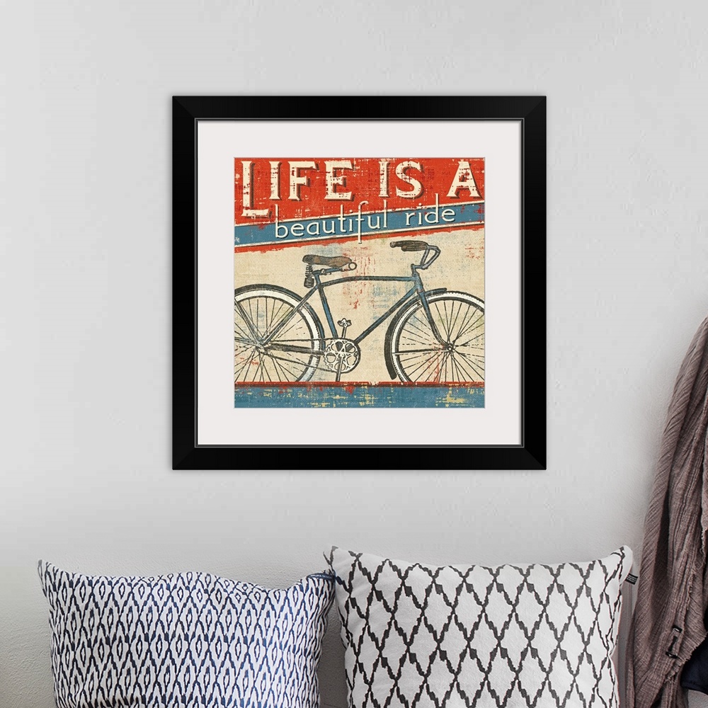 A bohemian room featuring Square wall art of a bicycle with retro typography inspired by vintage posters.