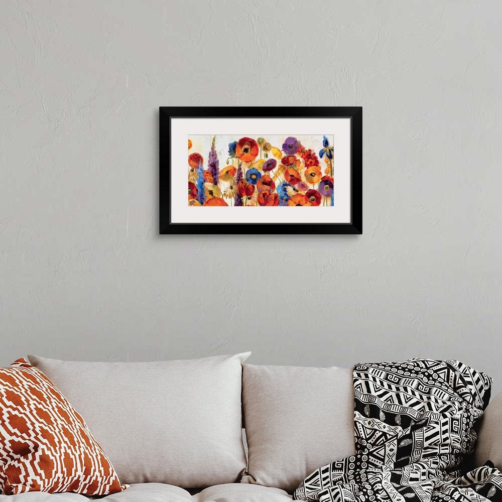 A bohemian room featuring A large canvas still life of a variety of vividly colored flowers for home art docor.