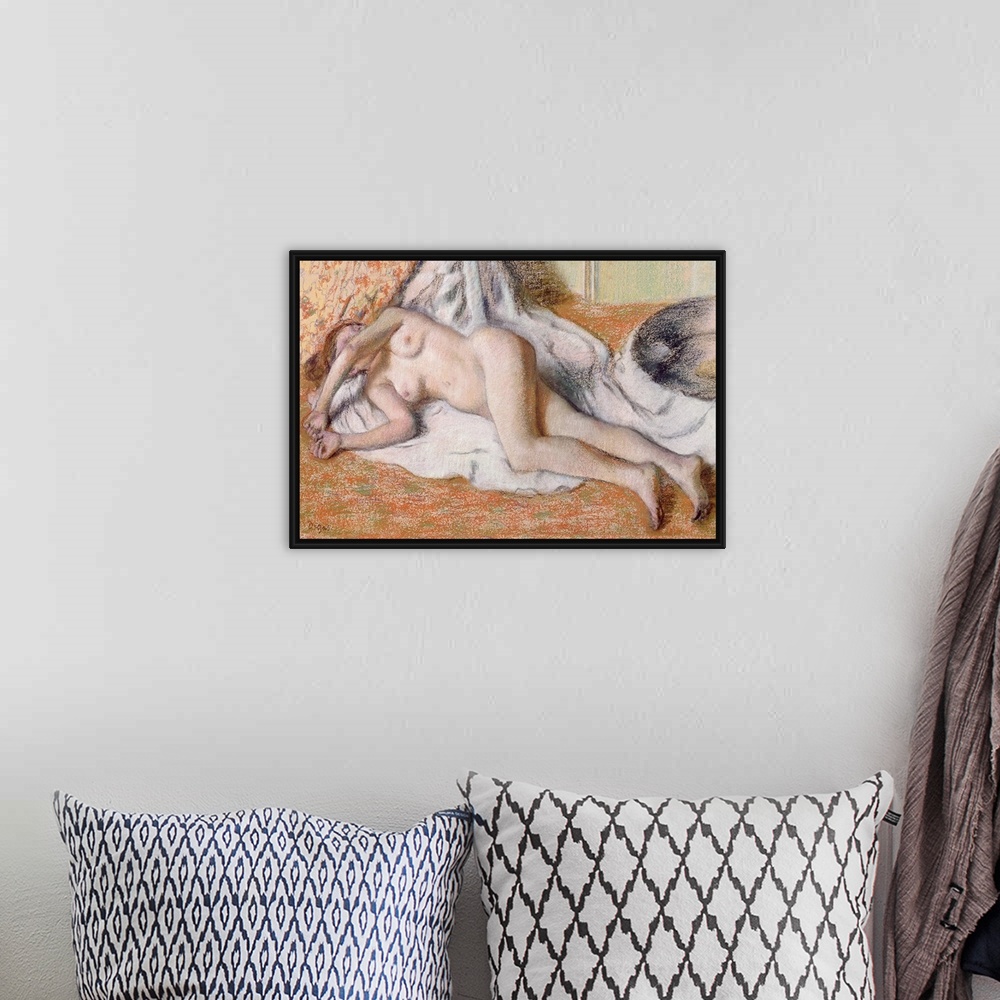 A bohemian room featuring Horizontal, classic artwork on a big canvas of a nude woman lying on her side on a draping white ...