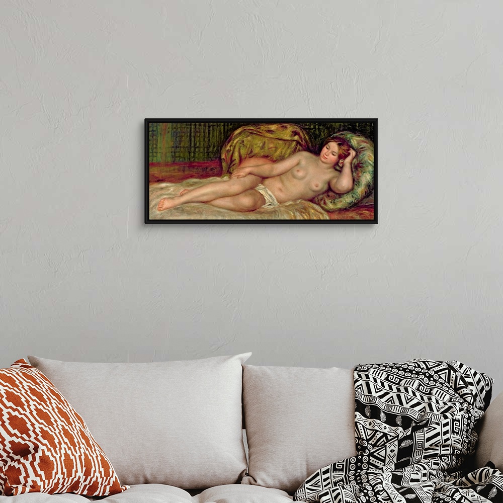 A bohemian room featuring Large, horizontal classic painting of a nude woman lying on a bed, surrounded by pillows.