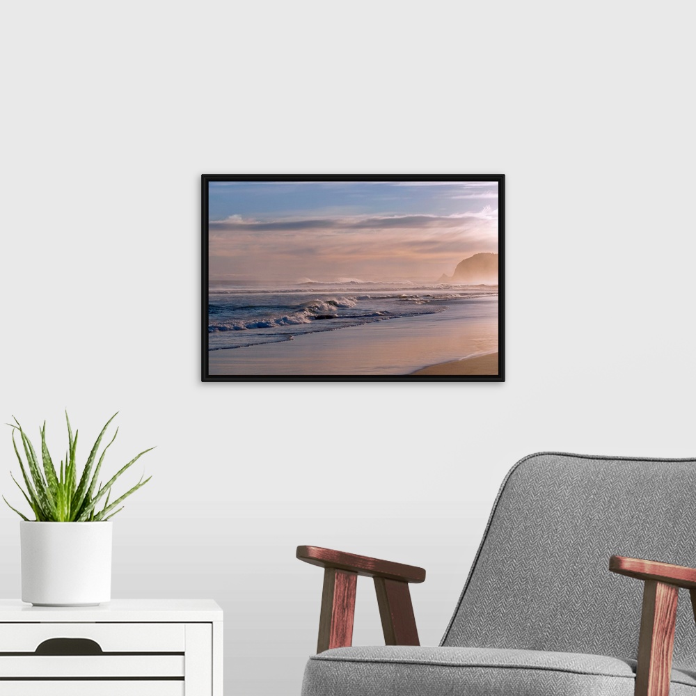 A modern room featuring Horizontal photograph on large canvas of waves crashing into the shoreline at St. Kilda, Dunedin....