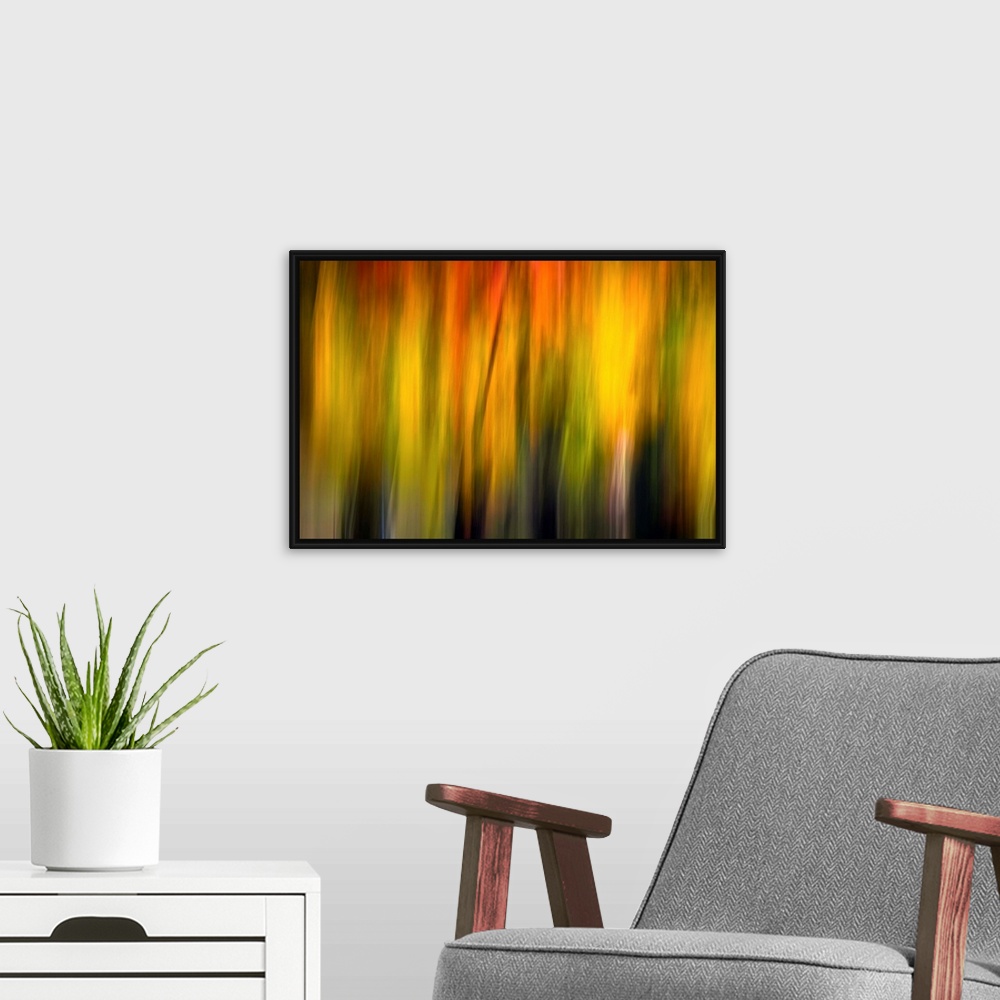 A modern room featuring Blurred artwork of what appears to be sunlight.
