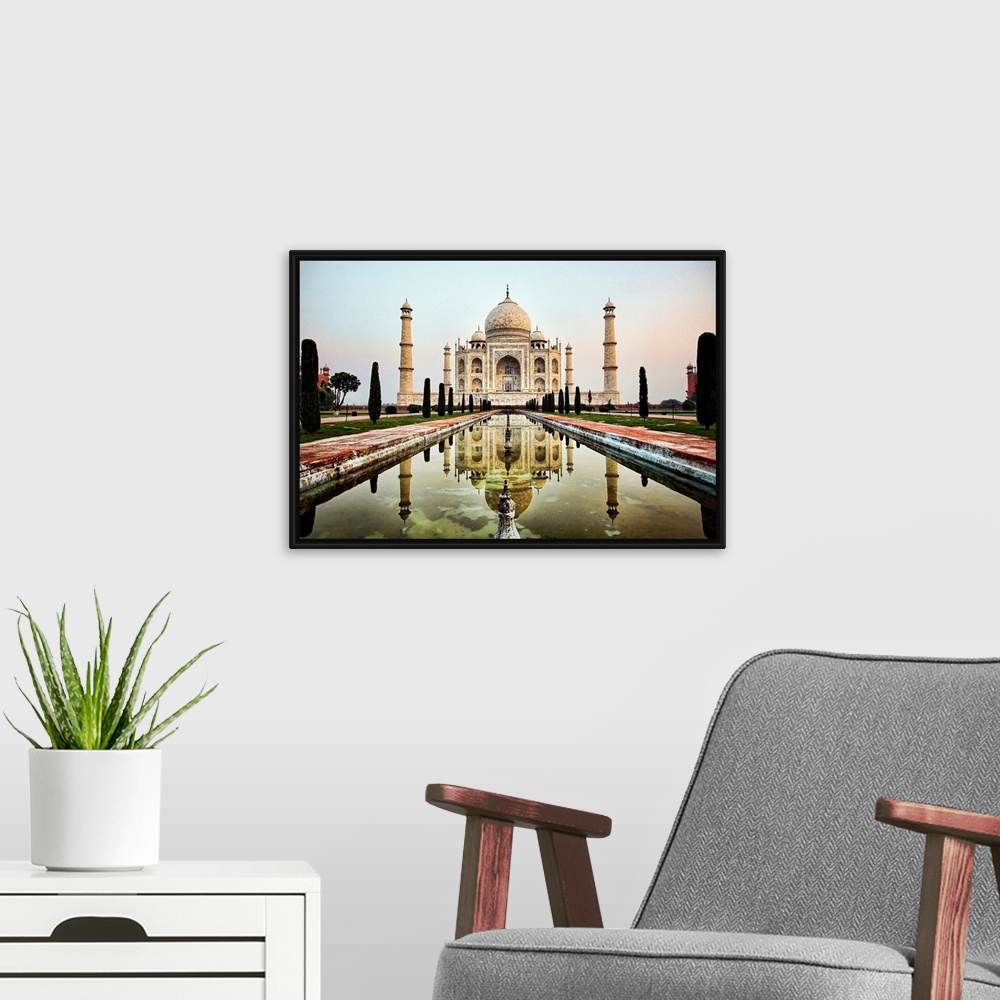 A modern room featuring Photograph of an ornate marble mausoleum.  A reflection pool is located in front lined with tall ...