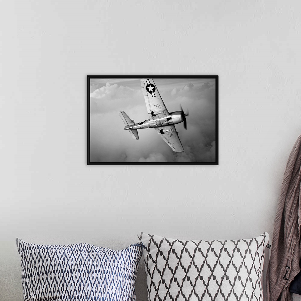 A bohemian room featuring Photograph of plane in flight in a cloudy sky over Chino, California.