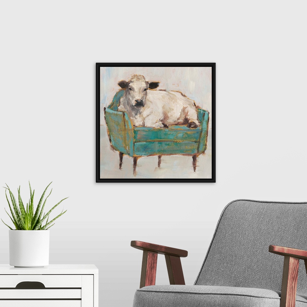 A modern room featuring A whimsical composition of a large white cow lying comfortably on a luxe teal sofa. With it's gol...