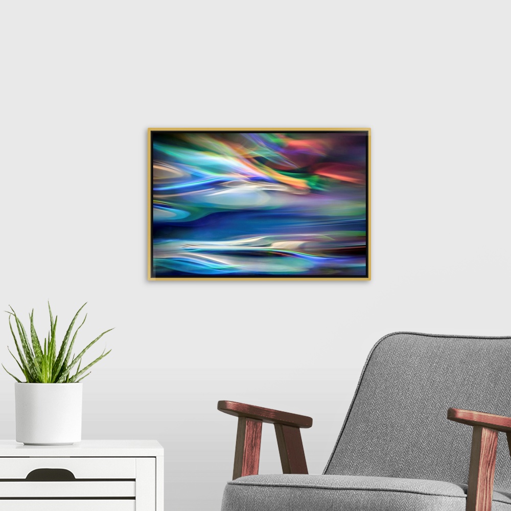 A modern room featuring Wall art that has moving multicolored lines that are composed in an abstract fashion.