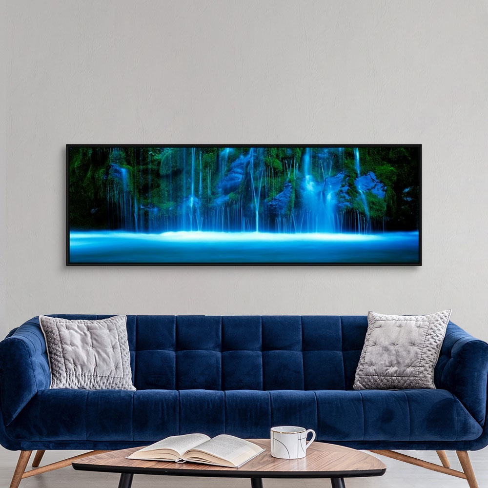 A modern room featuring A wide landscape panoramic photograph taken with a time lapsed technique of show the waterfallos ...