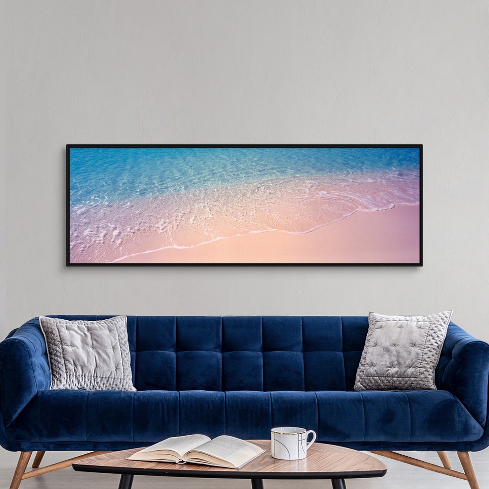 A modern room featuring Panoramic photograph concentrates on a small section of clear ocean water as it gently washes ont...