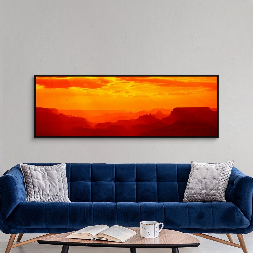 A modern room featuring Tonal panoramic photograph of canyon silhouettes at sunrise.