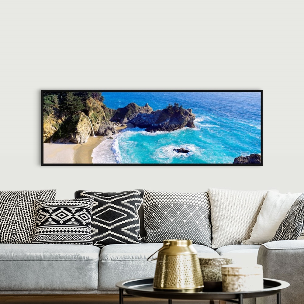 A bohemian room featuring Panoramic photograph of waves from the Pacific ocean crashing into the jagged rocks within McWay ...