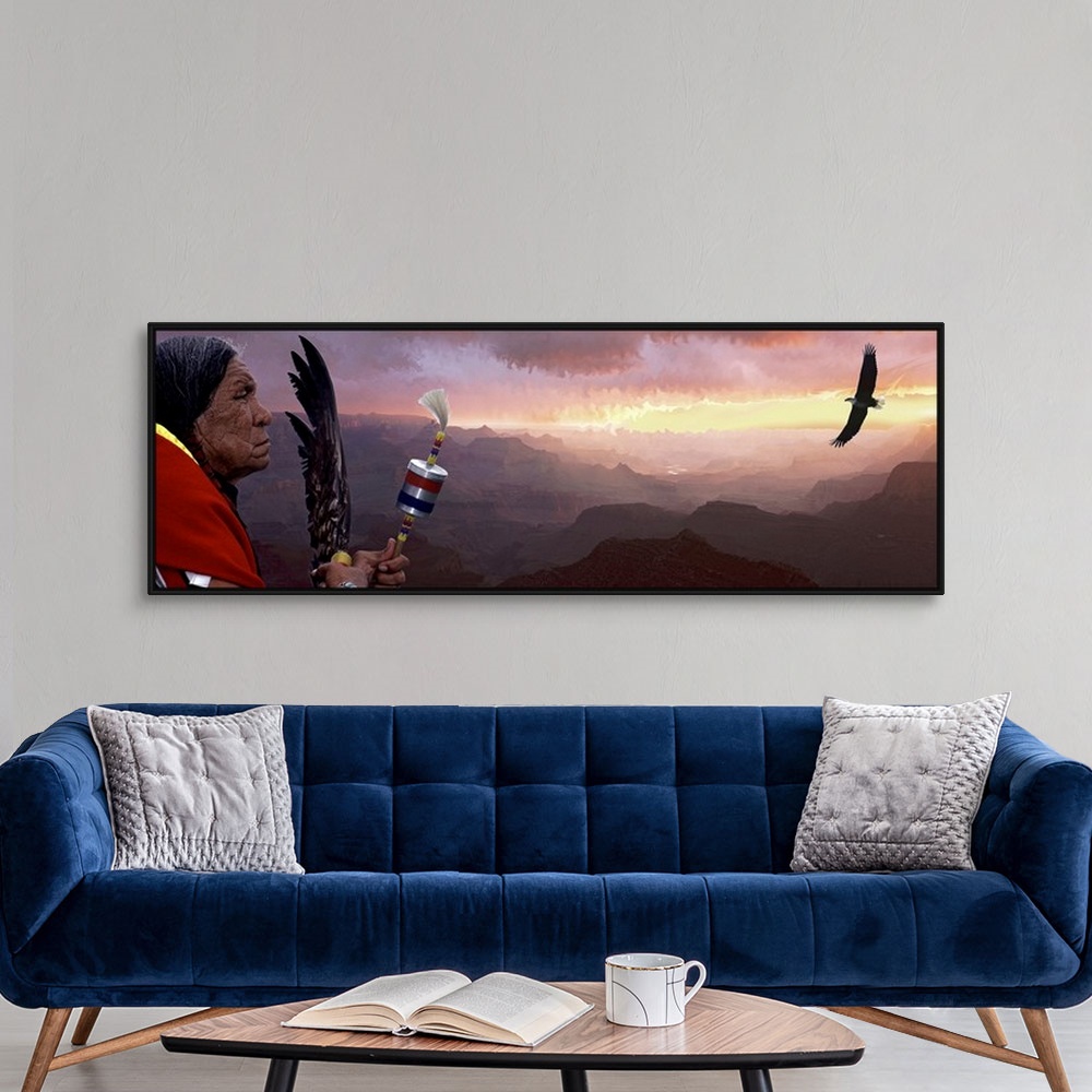 A modern room featuring Giant panoramic artwork featuring a Native American figure and flying bird with a vast mountain r...