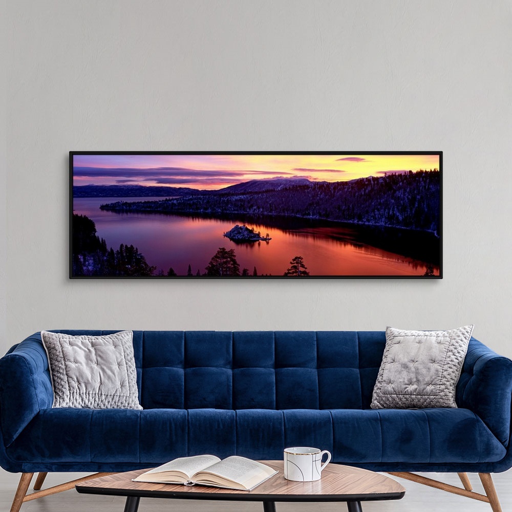 A modern room featuring Panoramic photograph of bay at sunset twisting through snow dusted mountains and trees.