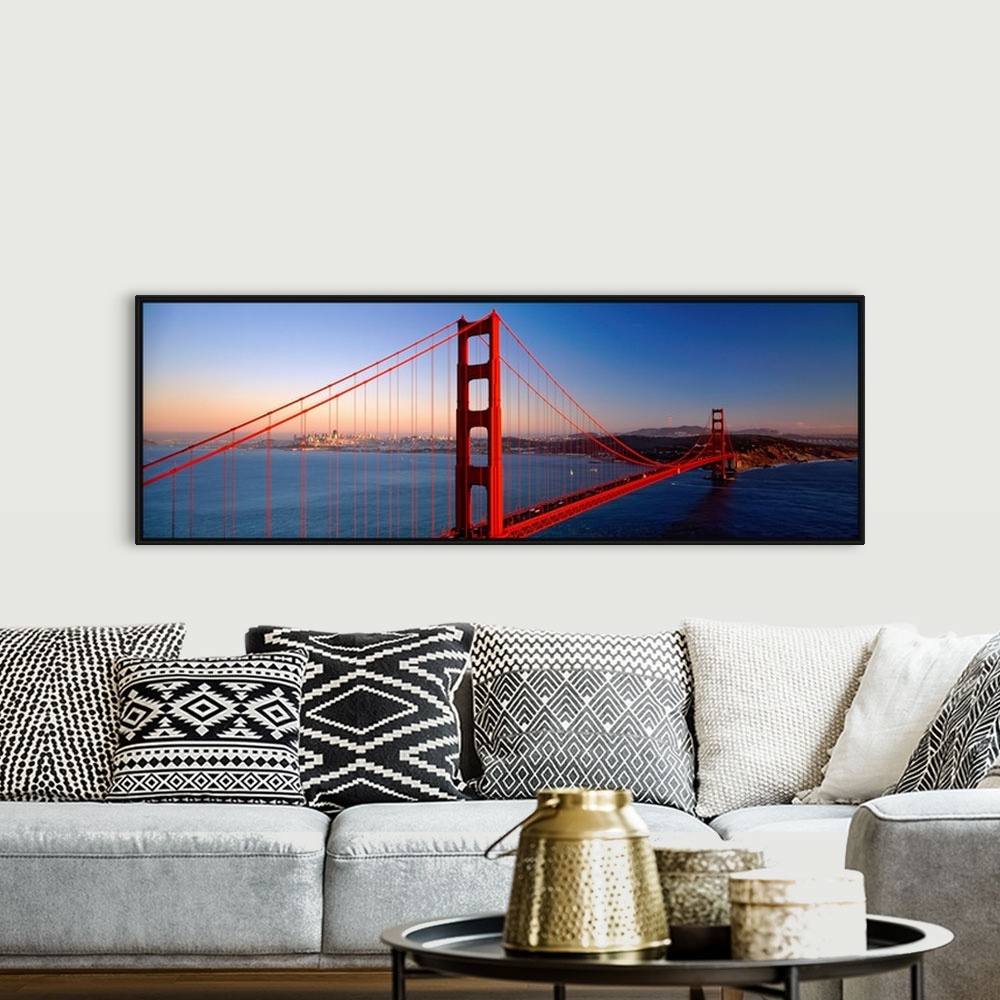 A bohemian room featuring Big landscape photograph of the Golden Gate Bridge extending over the blue waters of the San Fran...