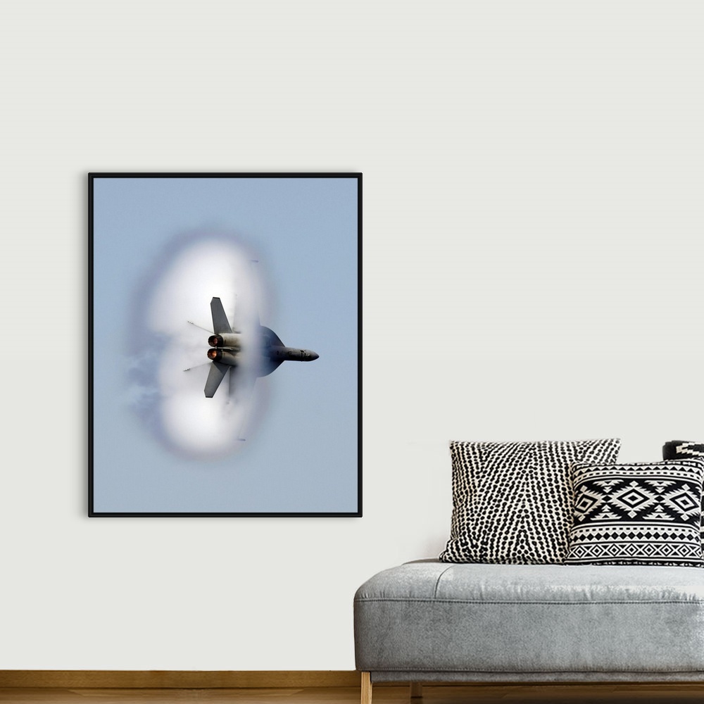 A bohemian room featuring A large piece of artwork that has a jet flying through a cloud of smoke.