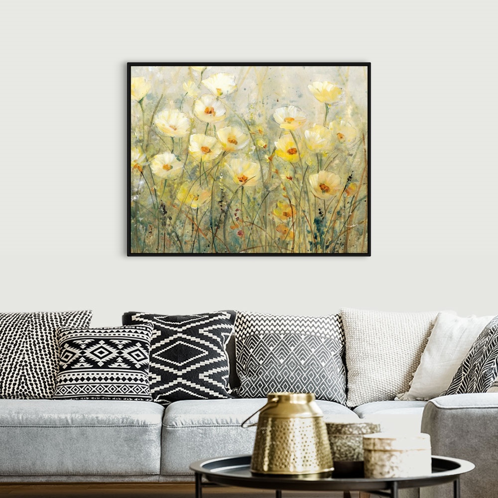 A bohemian room featuring Contemporary painting of several yellow flowers growing in a field.