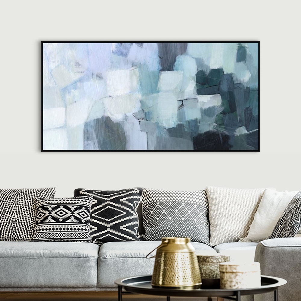 A bohemian room featuring A blocky, horizontal abstract image in seaglass shades of aqua, pale grey, light blue and dark te...