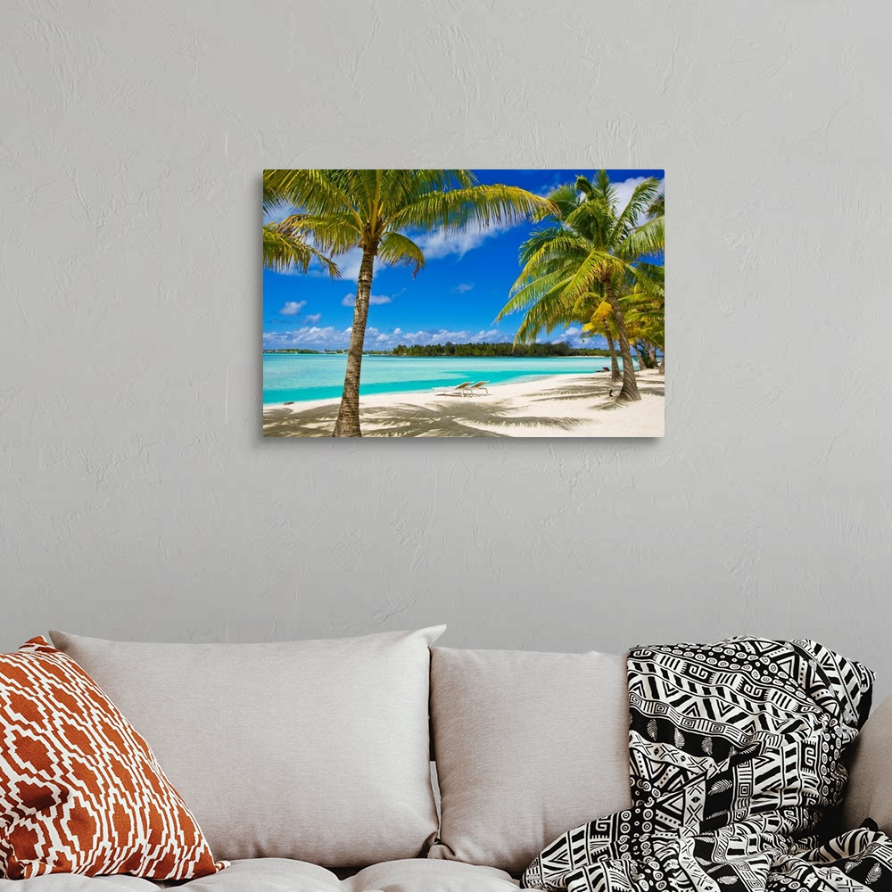Palm trees, lounge chairs, and white sand on a tropical beach Wall Art ...